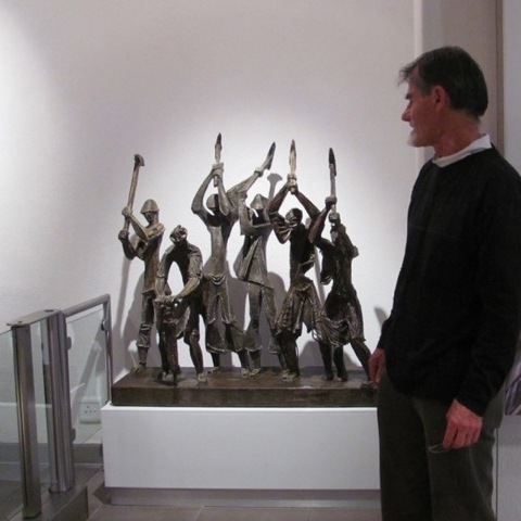 Daniel Kovacs with "Road Workers" by Zoltan Borbereki (metal and fibreglass) (Medical Centre, Claremont, Cape Town)